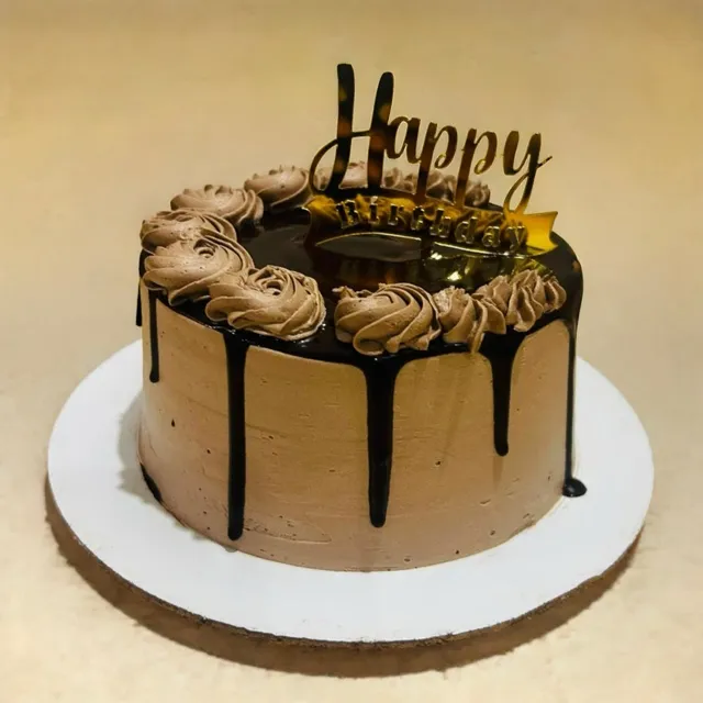 A Tall Gluten-Free Chocolate Drip — A gluten-free chocolate cake finished with a dark ganache drip, piped rosettes, and a gold-lettered topper.